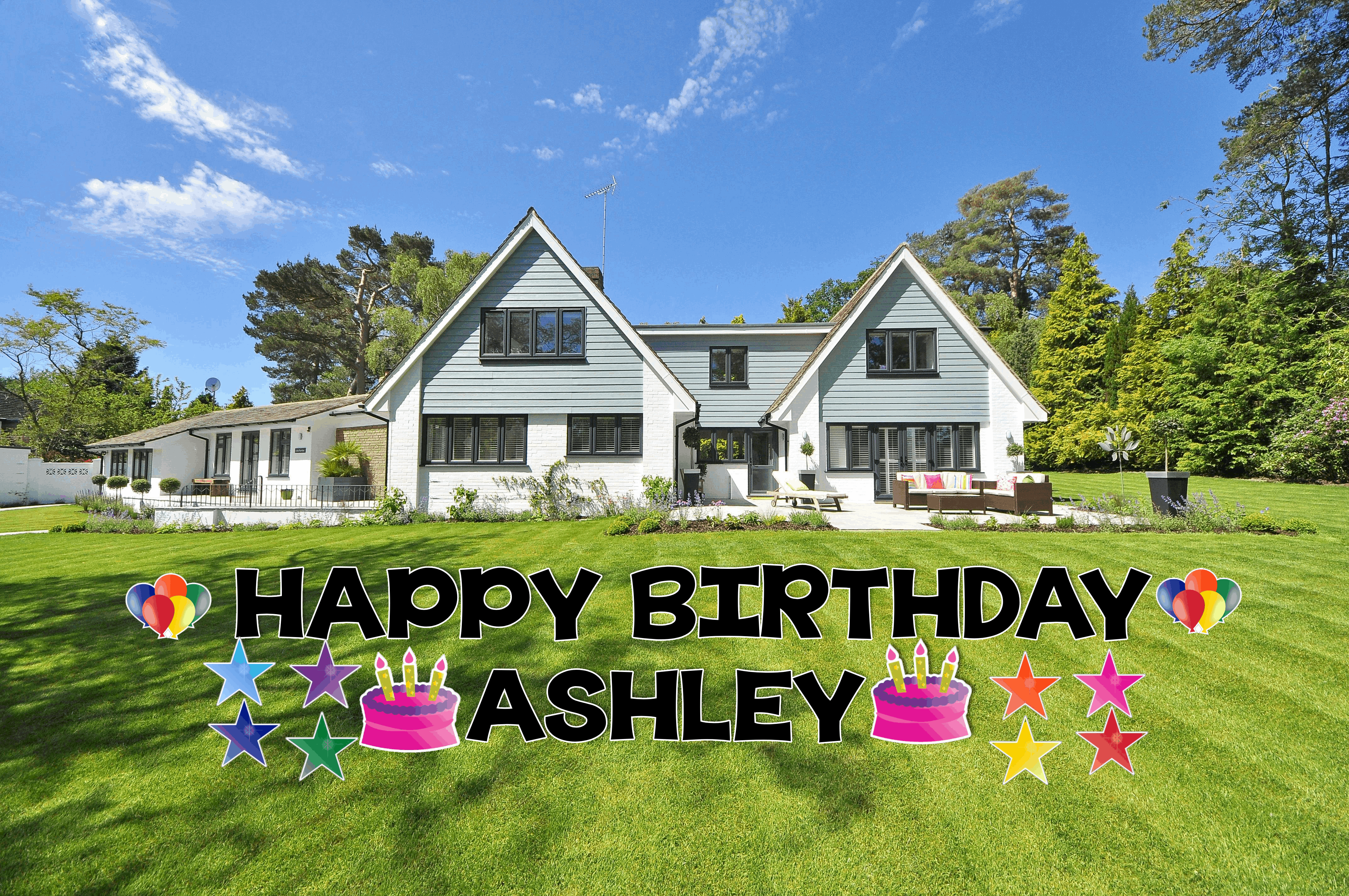 A yard sign that says 'Happy Birthday' with balloons.